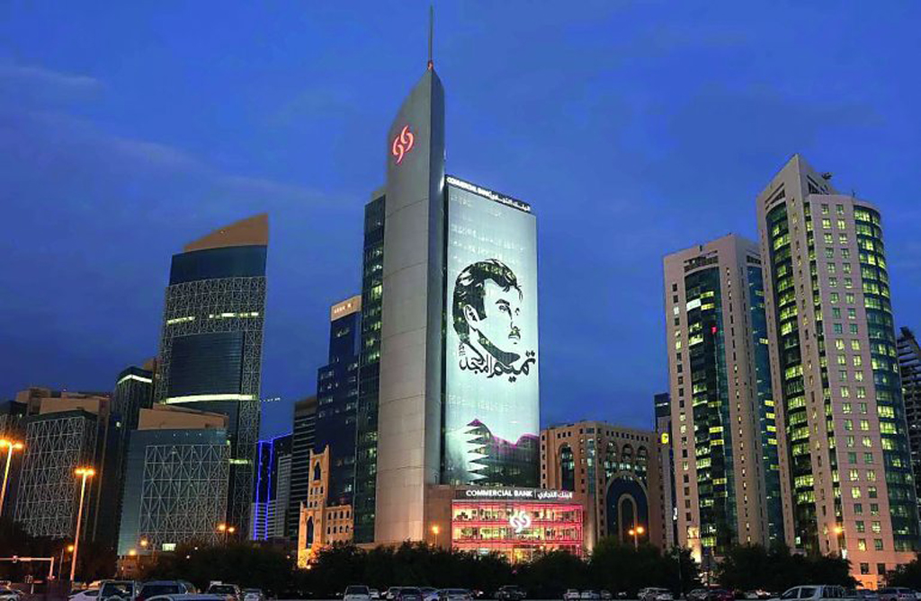 A night view of Commercial Bank headquarters in West Bay.