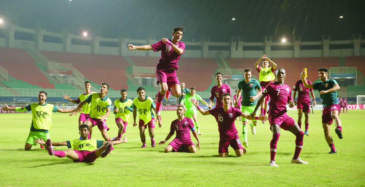 Qatari players celebrate after beating Chinese Taipei in their final Group A match of the AFC U-19 Championship in Jakarta, Indonesia yesterday.  