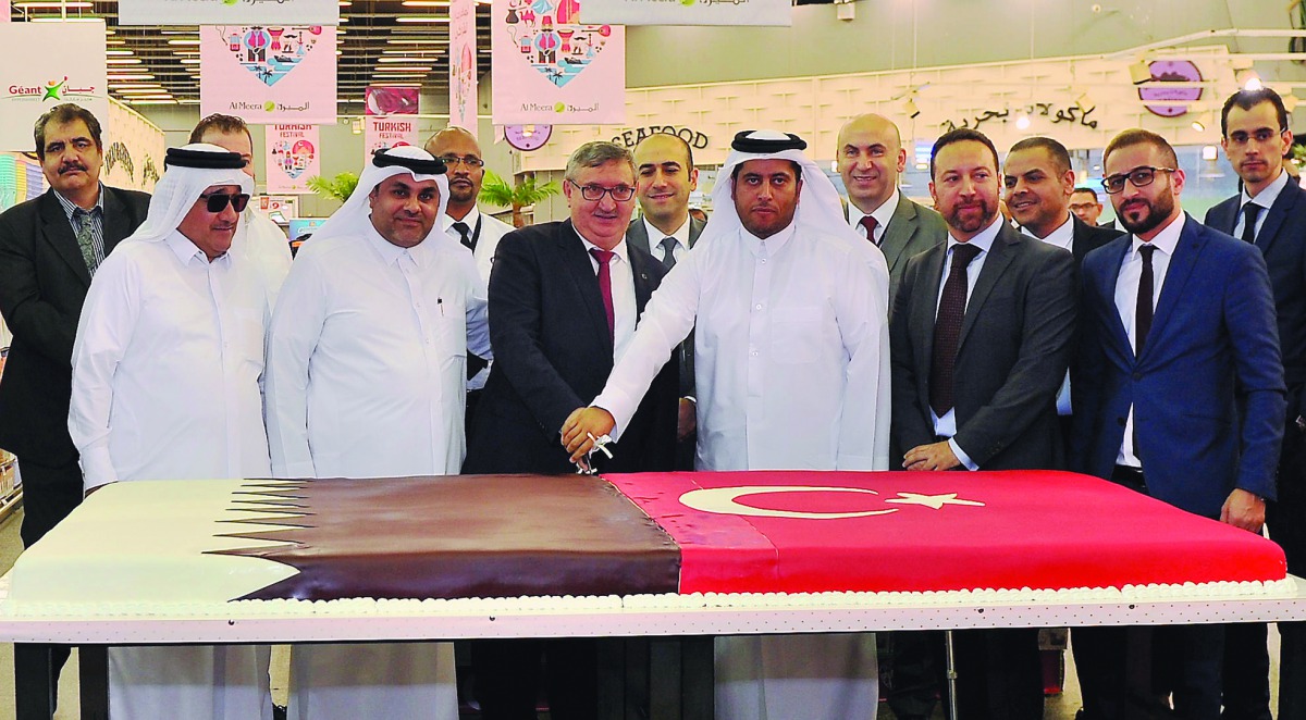 Fikret Özer, the Ambassador of Turkey to the State of Qatar, and Sheikh Thani bin Thamer bin Mohammed Al Thani, Al Meera Chairman, along with other dignitaries at the opening of the Turkish Festival at Al Meera yesterday. Pic: Baher Amin / The Peninsula
