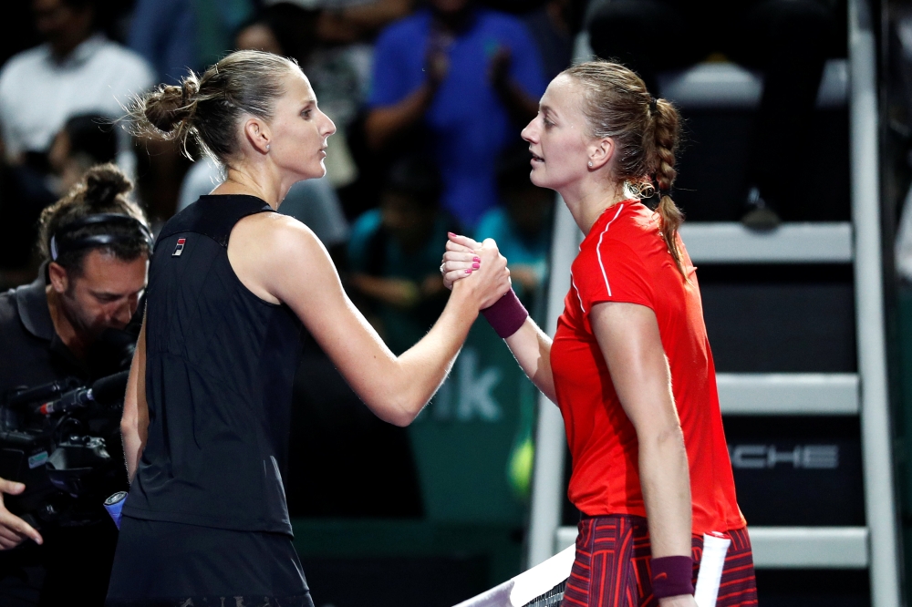 Czech Republic's Karolina Pliskova and Czech Republic's Petra Kvitova shake hands after their group stage match REUTERS/Edgar Su