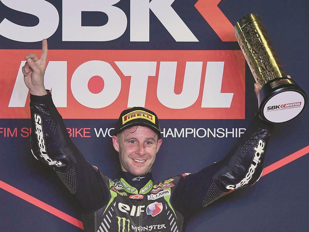 Jonathan Rea celebrates on the podium after winning the first race of WorldSBK yesterday.