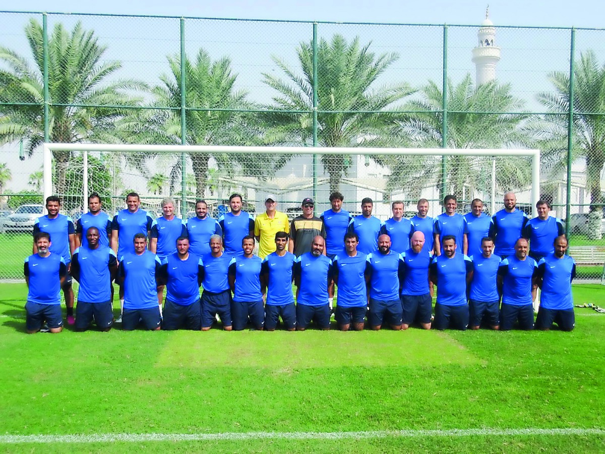 Coaches who took part in the Football Workshop pose for a picture.