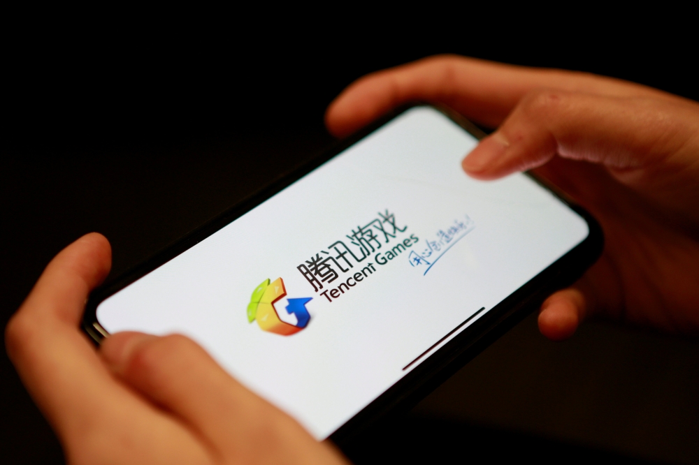 A Tencent Games logo from an app is seen on a mobile phone in this illustration picture taken November 5, 2018. REUTERS/Florence Lo/Illustration/File Photo
