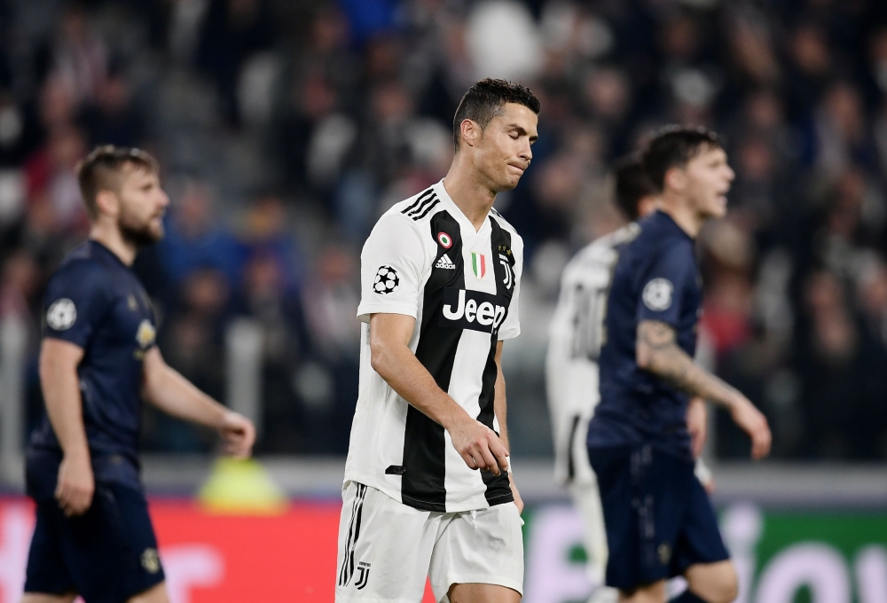 Juventus' Portuguese forward Cristiano Ronaldo reacts at the end of the UEFA Champions League group H football match Juventus vs Manchester United at the Allianz stadium in Turin on November 7, 2018. / AFP / Marco BERTORELLO