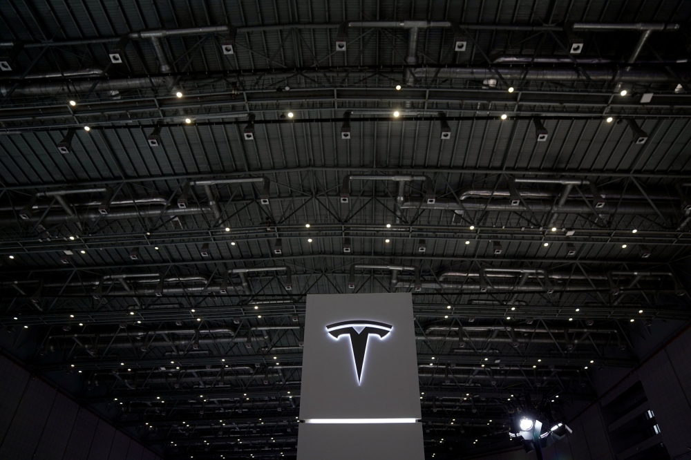 A Tesla sign is seen during the China International Import Expo (CIIE), at the National Exhibition and Convention Center in Shanghai, China November 6, 2018. REUTERS/Aly Song