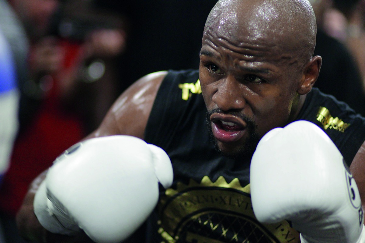 In this file photo taken on August 10, 2017 Boxer Floyd Mayweather Jr. goes through moves during a media workout at the Mayweather Boxing Club in Las Vegas, Nevada.  AFP / John Gurzinski
