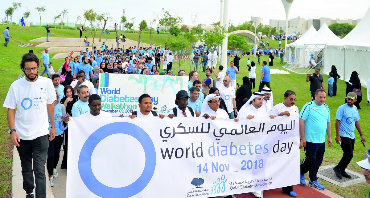People join officials during a 1km walkathon organised by Qatar Diabetes Association to mark the World Diabetes Day at the Oxygen Park in Education City, yesterday.  #Pic:Salim Matramkot/The Peninsula