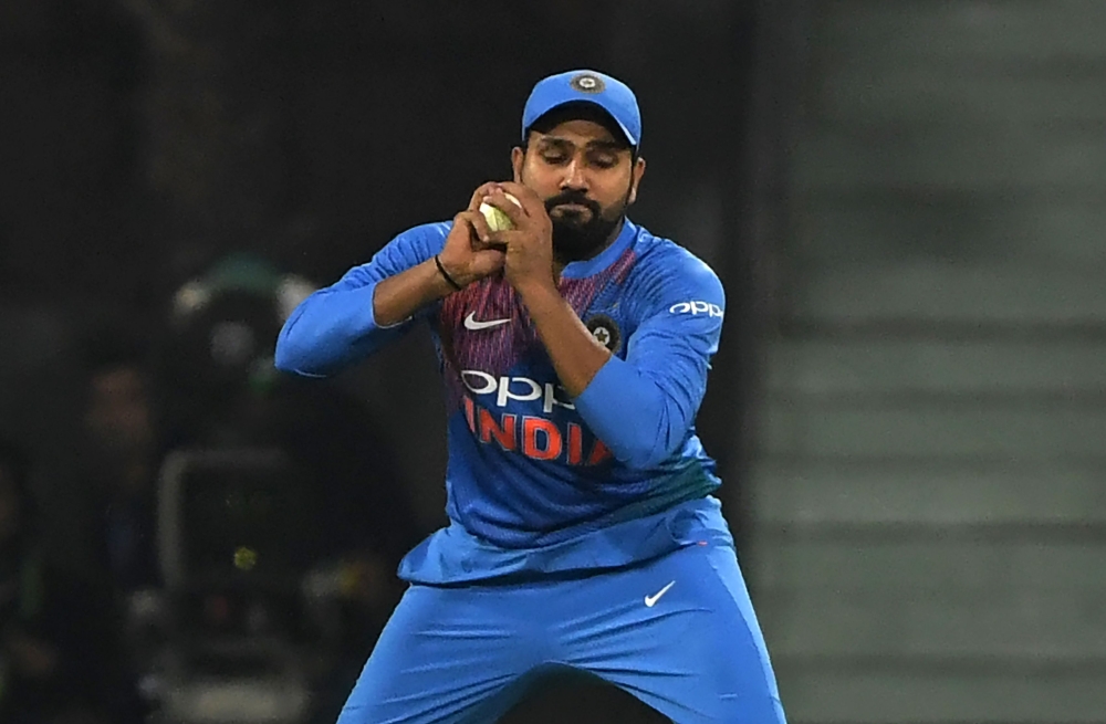 Indian captain Rohit Sharma takes a catch to dismiss West Indies batsman Keemo Paul during the second T20 cricket match between India and West Indies at The Bharat Ratna Atal Bihari Vajpayee Ekana Cricket Stadium in Lucknow on November 6, 2018. GETTYOUT /
