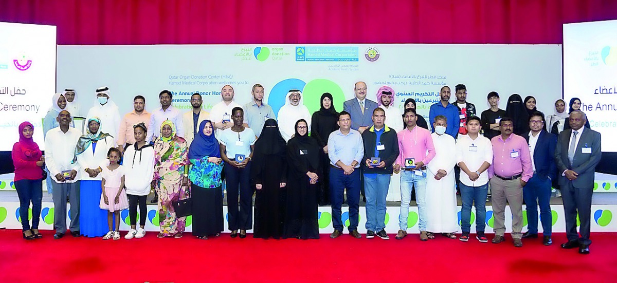 Minister of Public Health, H E Dr Hanan Mohamed Al Kuwari, with Qataris and expatriates who were awarded the ‘Medal of Altruism’ during a special ceremony to honour living donors as well as the families of deceased donors.