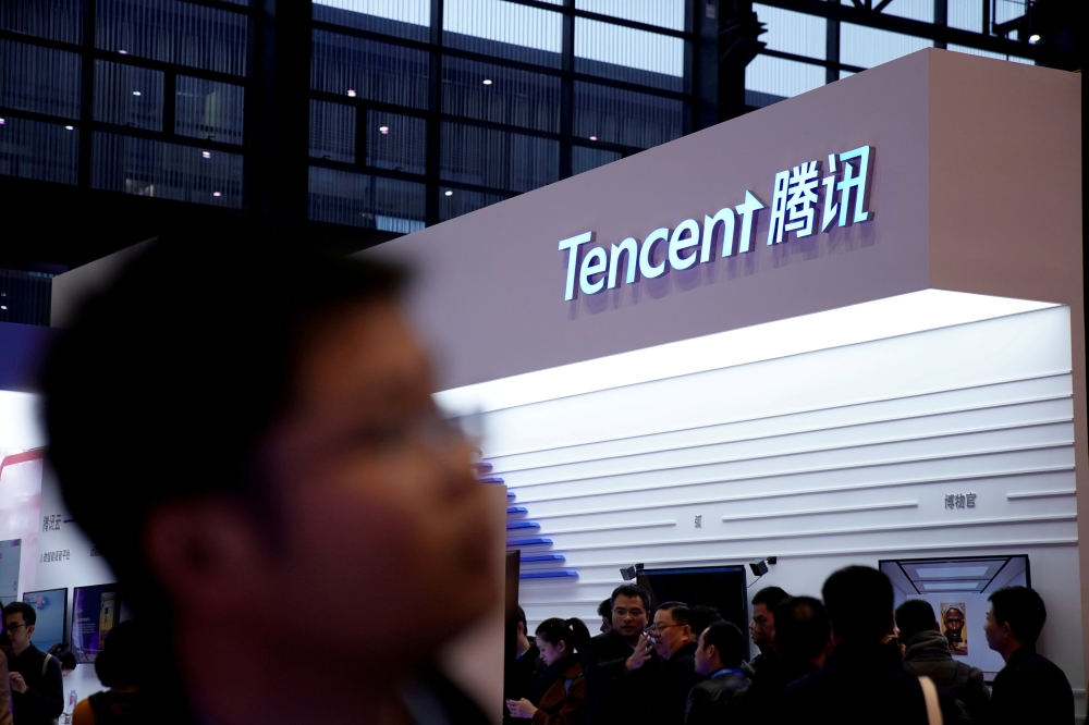 FILE PHOTO: A sign of Tencent is seen during the fourth World Internet Conference in Wuzhen, Zhejiang province, China December 3, 2017. REUTERS/Aly Song