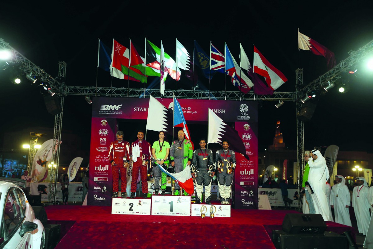 The podium winners of the 2018 Manateq International Rally of Qatar, celebrate after the presentation ceremony at iconic Souq Waqif yesterday. 