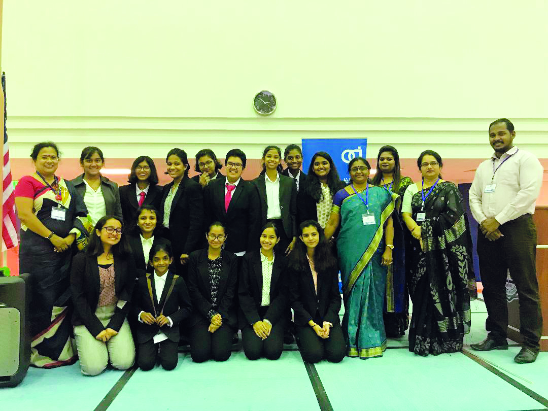 DPSMIS debating team members and officials pose for a group photo. 