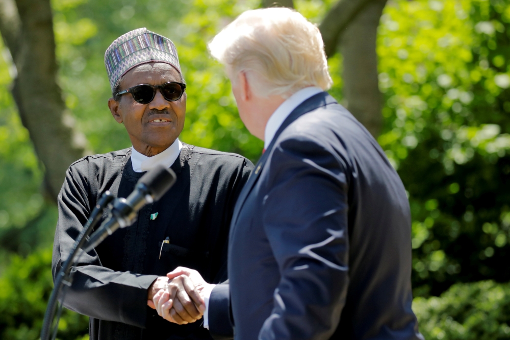 US President Donald Trump and Nigeria’s President Muhammadu Buhari shake hands as they hold a joint news conference in the Rose Garden at the White House, April 30, 2018. Reuters/Carlos Barria