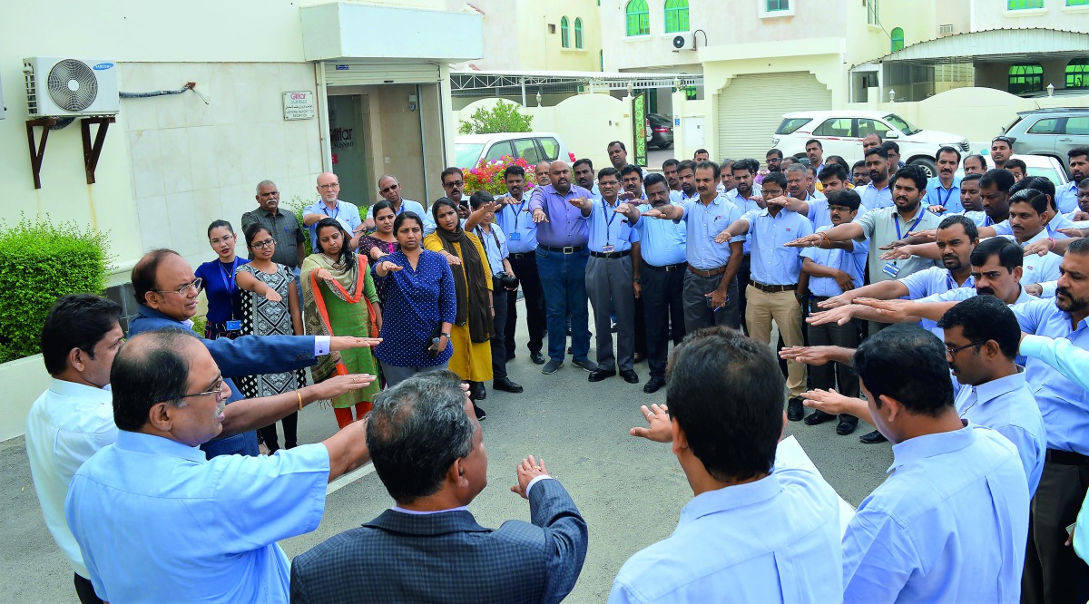 Employees of Galfar Al Misnad taking a ‘quality pledge’ at the beginning of company’s fifth annual Quality Week.