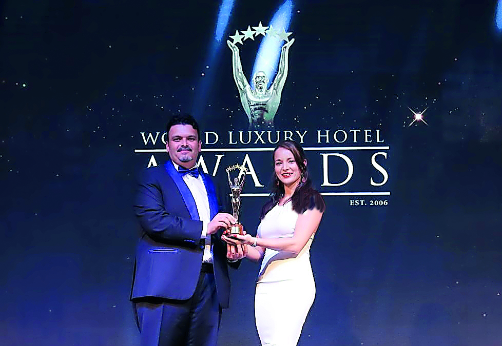 An official of Sealine Beach, a Murwab Resort receiving the award.