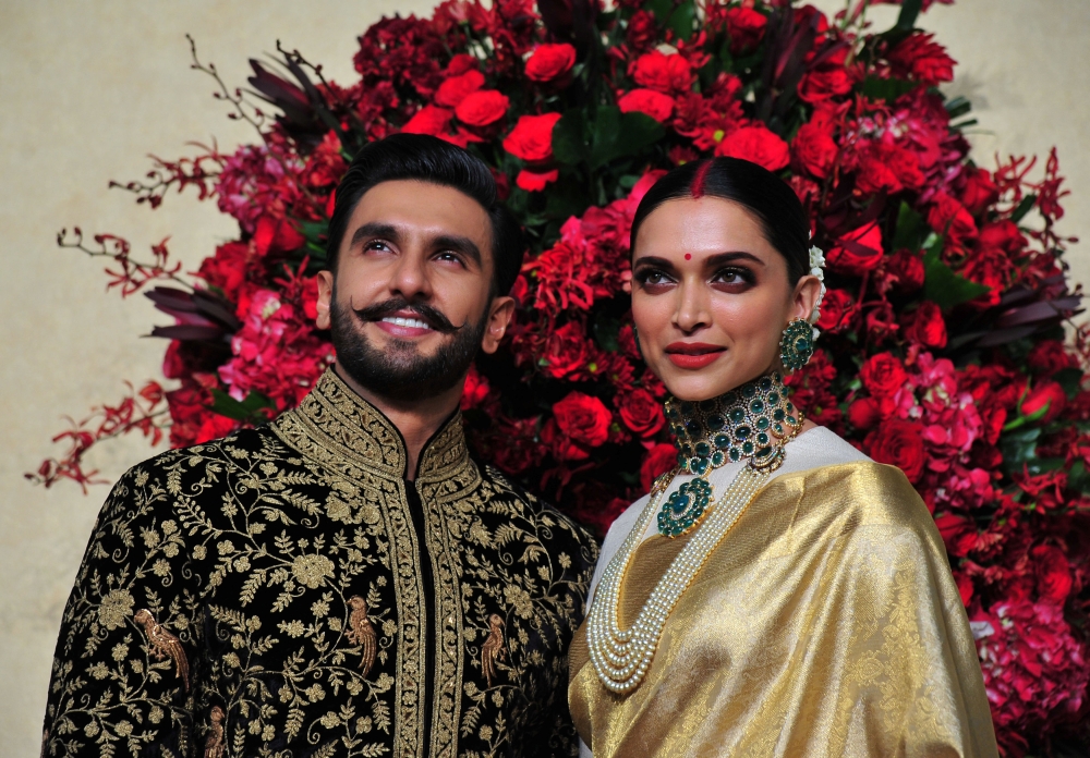 Bollywood actors Ranveer Singh and Deepika Padukone pose during a photo-op at their wedding reception in Bengaluru, India, November 21, 2018. REUTERS/Stringer
 