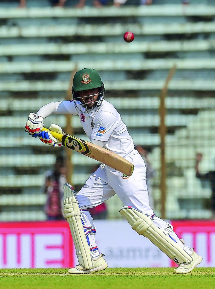 Bangladesh cricketer Mominul Haque plays a shot during the first day of the first Test cricket match between Bangladesh and West Indies at the Zahur Ahmed Chowdhury Stadium in Chittagong on November 22, 2018. AFP / Munir Uz Zaman
