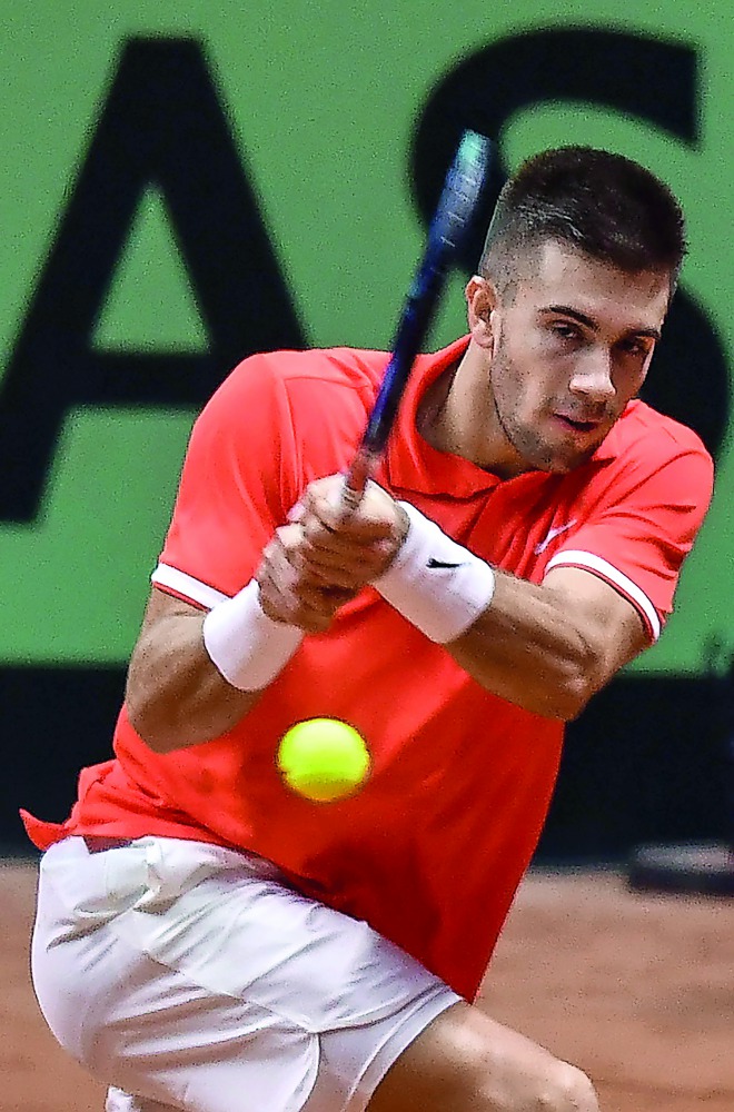 Croatian's Borna Coric plays a backhand return in his singles rubber against France's Jeremy Chardy during the Davis Cup final tennis match between France and Croatia at The Pierry-Mauroy Stadium in northern France on November 23, 2018. AFP / Denis Charle