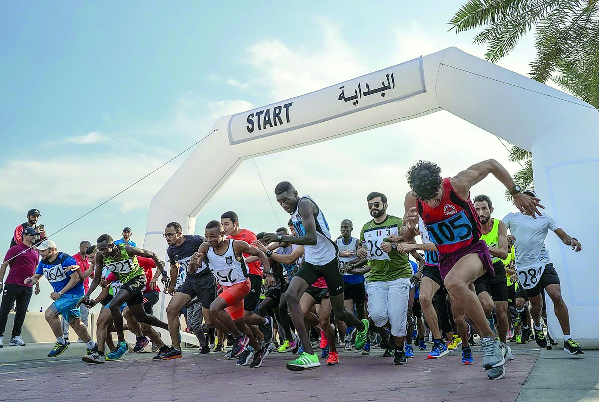 Athletes take part in the annual Olympic Day Run at Doha Corniche yesterday.