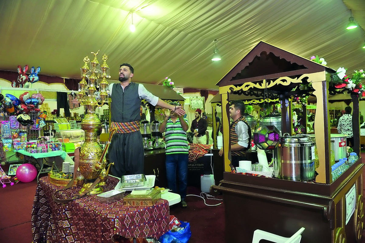 A traditional Syrian juice vendor calls customers at the souq set up at the MIA Park on the sidelines of “Syria Matters” exhibition, yesterday. Pic: Baher Amin / The Peninsula