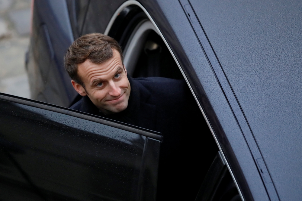 French President Emmanuel Macron leaves after attending a 