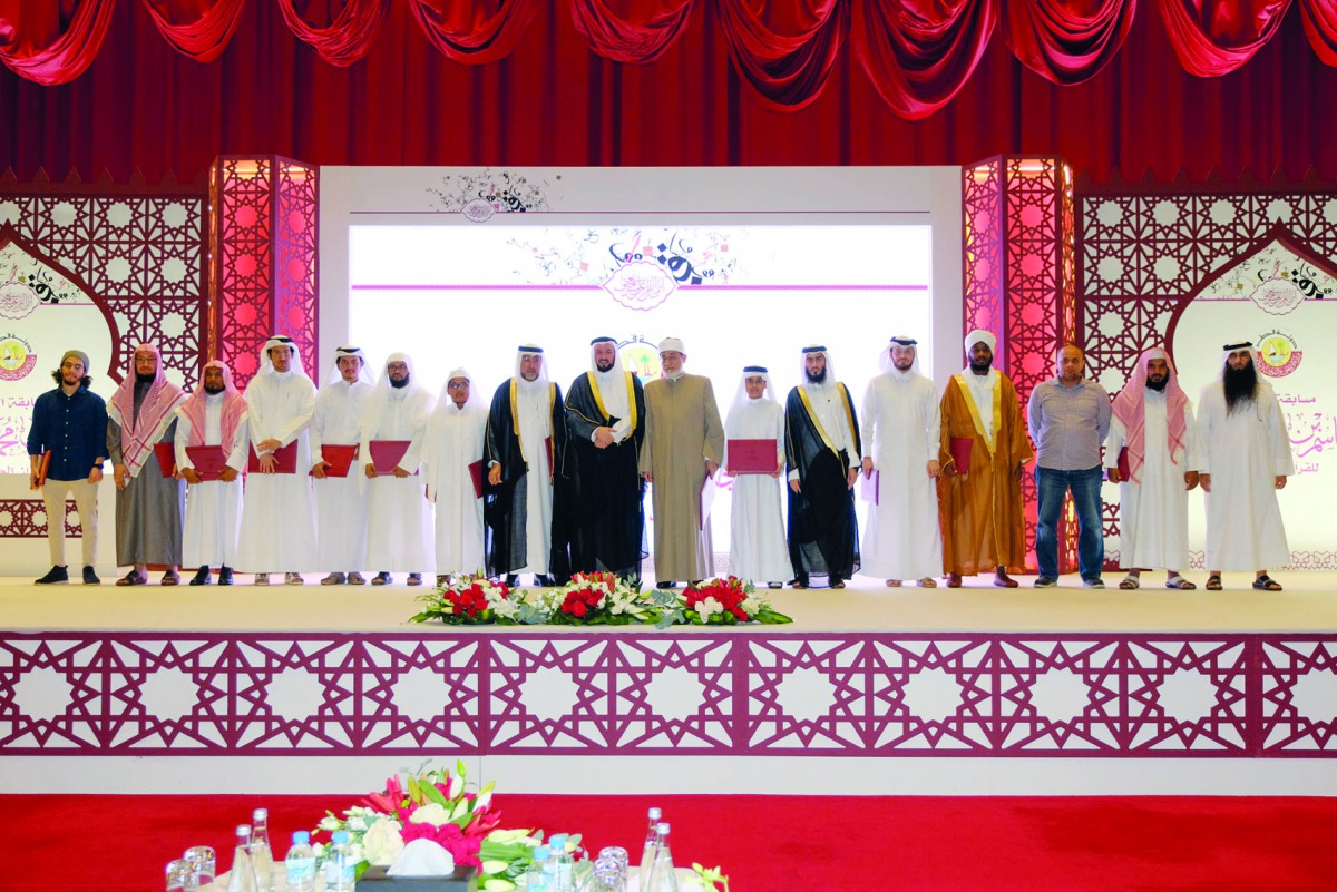 Minister of Awqaf and Islamic Affairs, H E Dr Ghaith bin Mubarak Al Kuwari, with the winners and other officials during the ceremony. 
