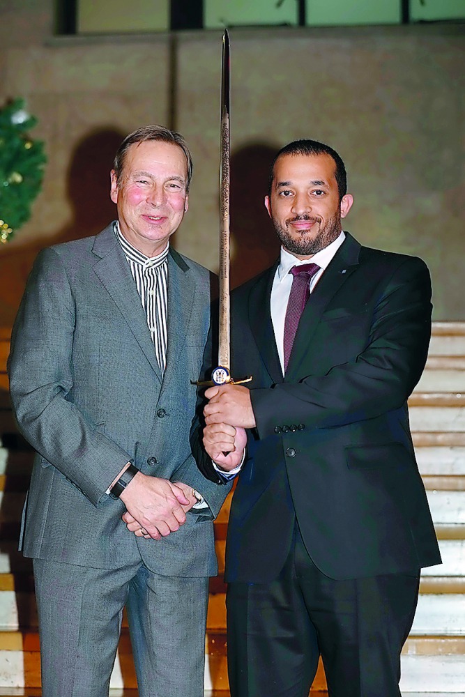 Officials with the Sword of Honour Award.