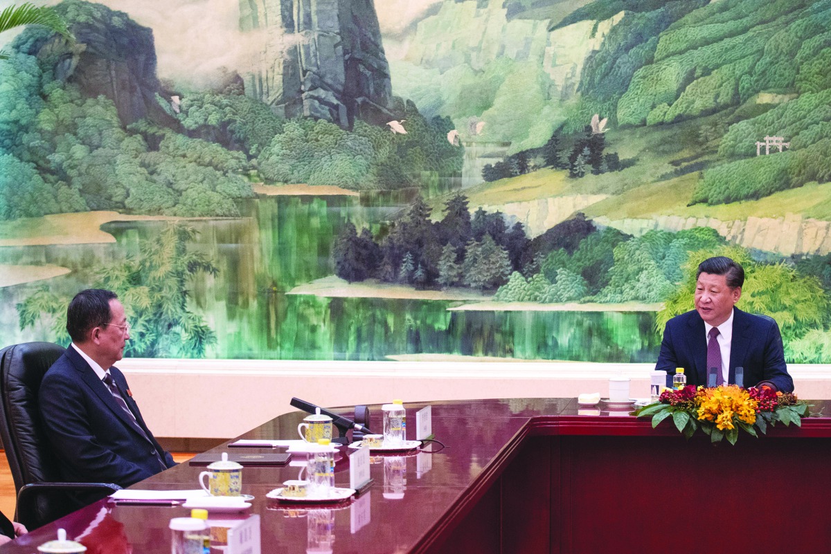 China's President Xi Jinping speaks to North Korean Foreign Minister Ri Yong Ho at the Great Hall of the People in Beijing, China December 7, 2018. Fred Dufour/Pool via Reuters