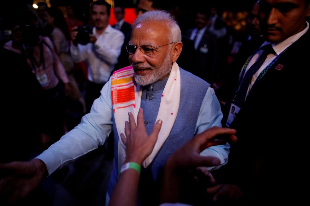 FILE PHOTO: Indian Prime Minister Narendra Modi greets attendees at the end of a sideline event ahead of the Group 20 summit called 