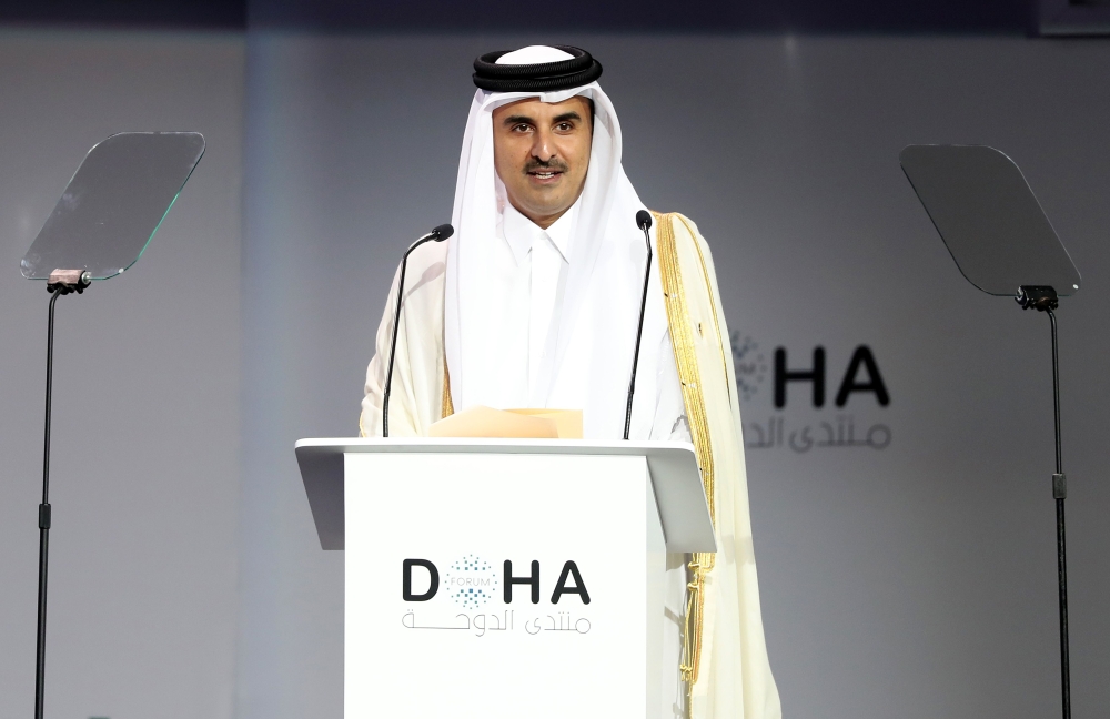 Qatar's Emir Sheikh Tamim bin Hamad Al-Thani, delivers a speech during the opening session of the Doha Forum in the Qatari capital on December 15, 2018. AFP / KARIM JAAFAR