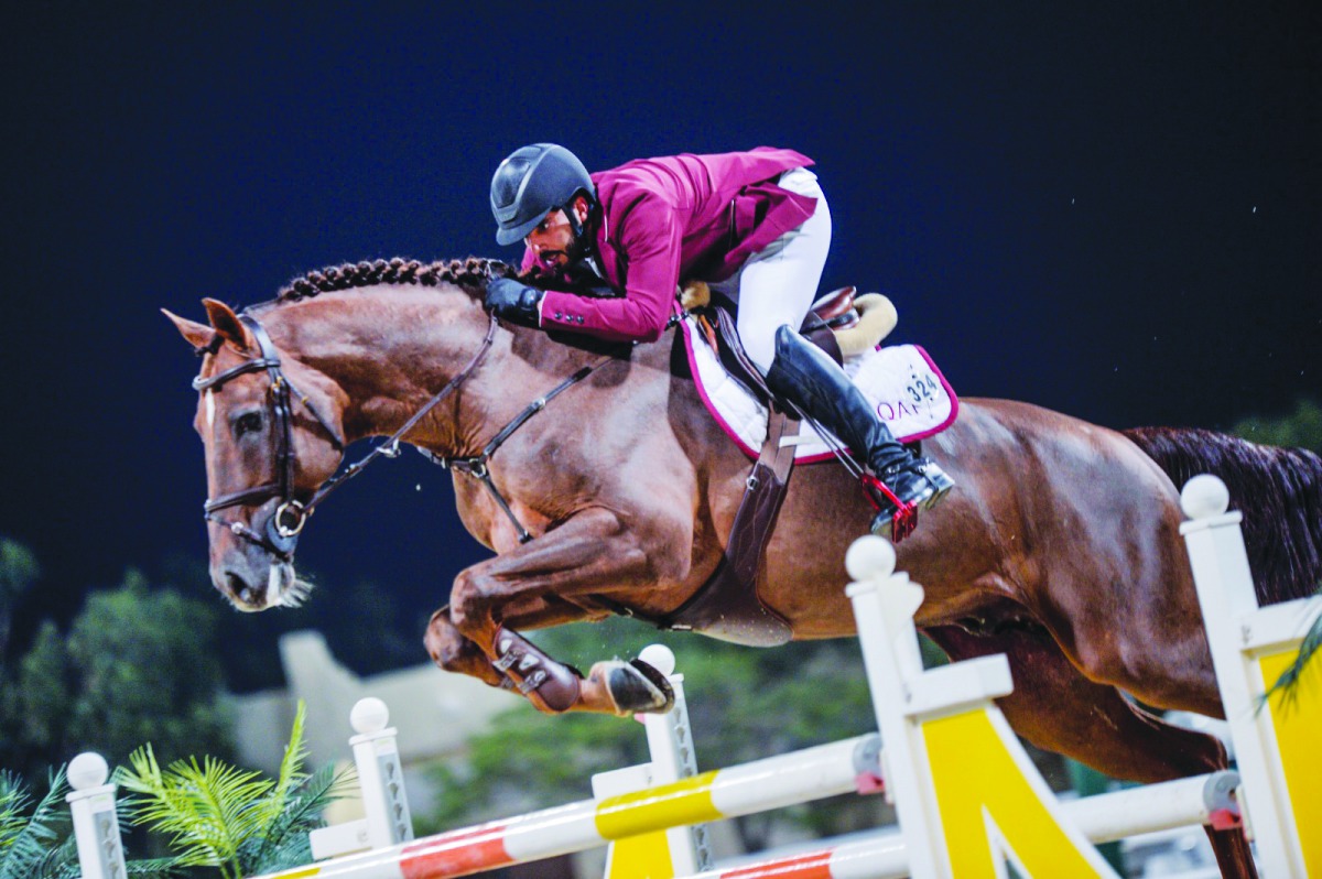 Mubarak Yousuf Al Rumaimi guides Vivaldi K over an obstacle during the Big Tour competition on the second day of fourth round of the Hathab Show Jumping Series at Qatar Equestrian Federation’s  (QEF) Outdoor Arena yesterday. 