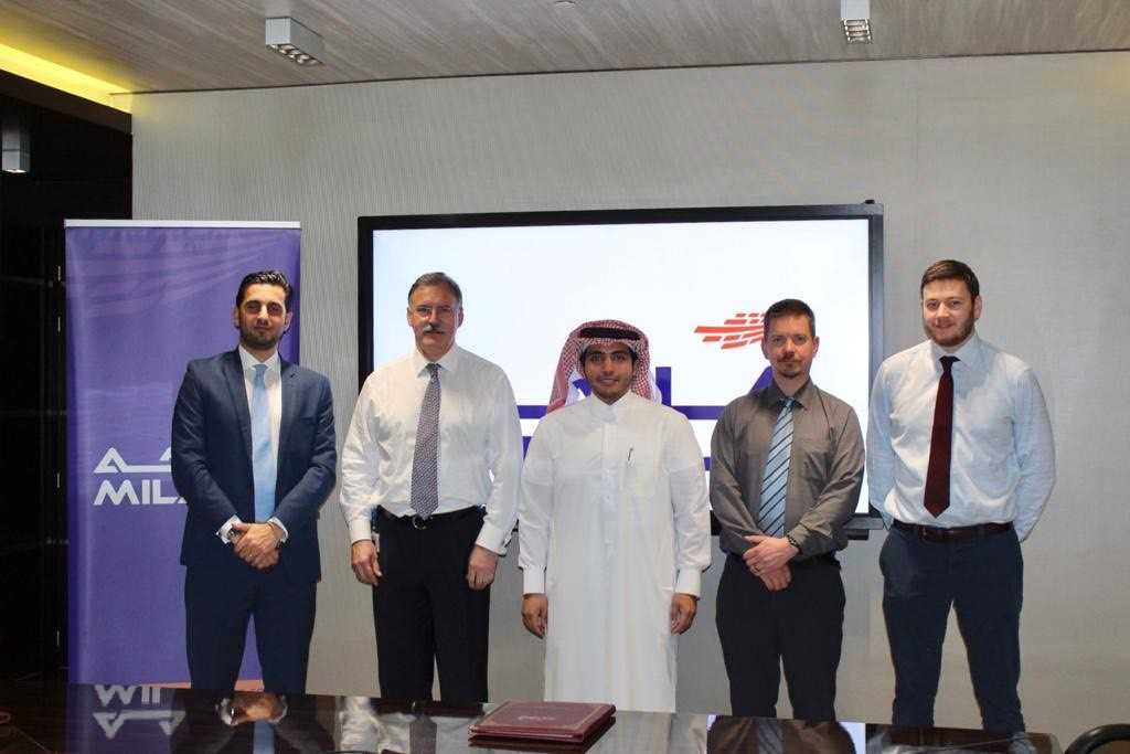 Milaha and Royal HaskoningDHV officials pose for a group picture.