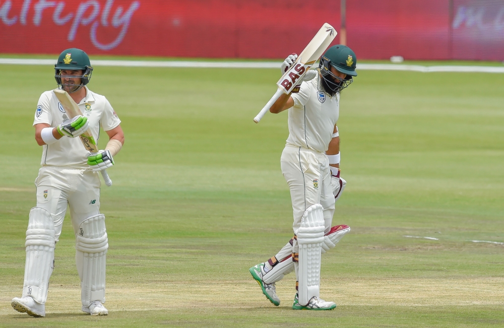 South Africa's Hashim Amla reacts after scoring his fifty runs during day three of the 1st cricket test match between South Africa and Pakistan at SuperSport Park cricket stadium on December 28, 2018 in Pretoria. (AFP / Christiaan Kotze)
