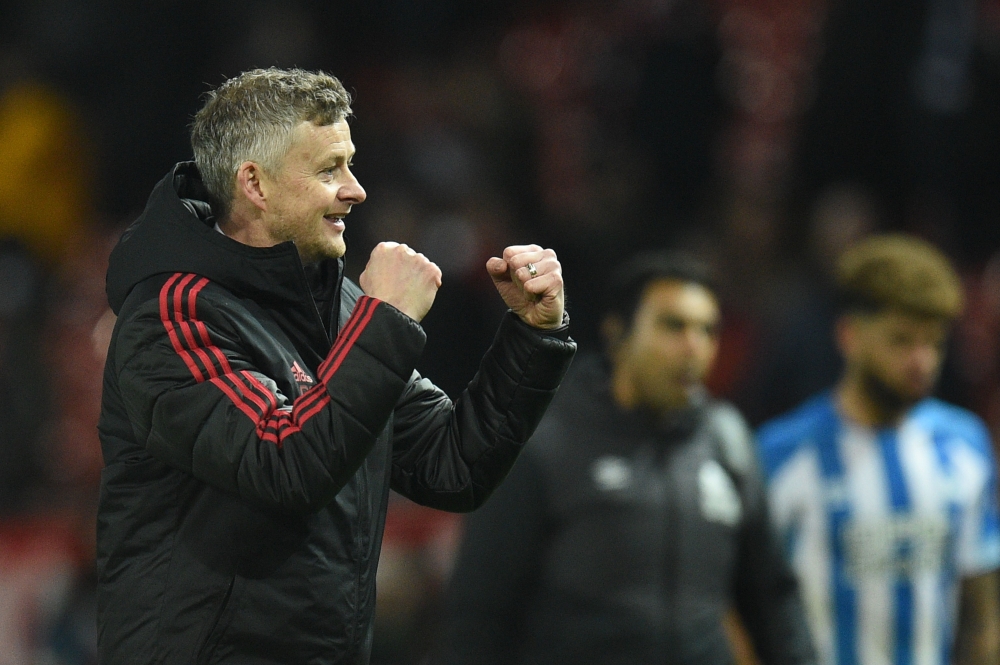 Manchester United's Norwegian caretaker manager Ole Gunnar Solskjaer gestures at the end of the English Premier League football match between Manchester United and Huddersfield Town at Old Trafford in Manchester, north west England, on December 26, 2018. 