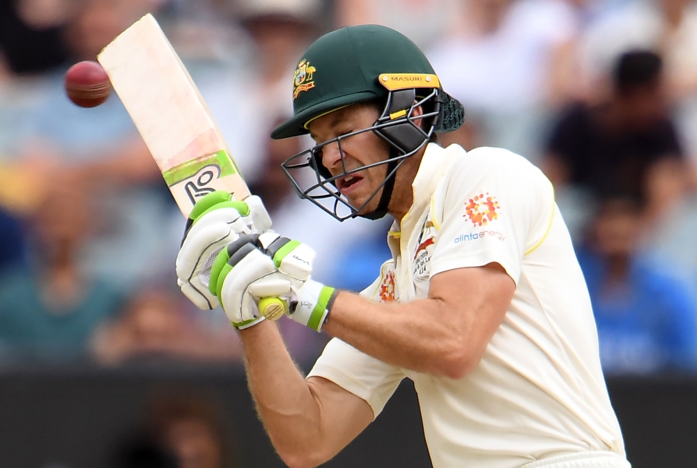 Australia's batsman Tim Paine tries to avoid a bouncer during day four of the third cricket Test match between Australia and India in Melbourne on December 29, 2018.AFP / WILLIAM WEST 