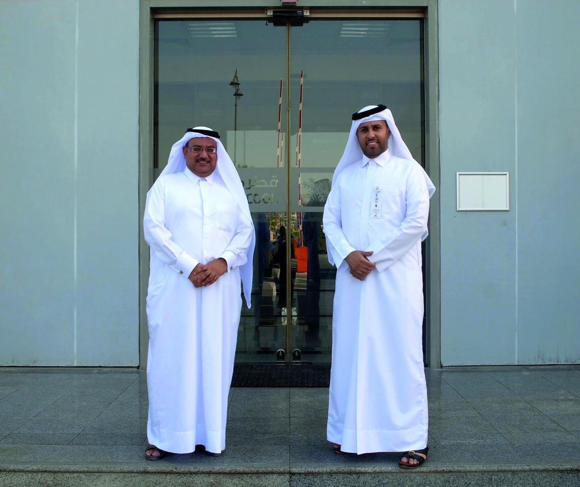 Nahar Al Mutawah, head of Operations and Maintenance Sector at Qatar Cool, and Khaled Al Yazidi, Head of Public Relation Department at Qatar Charity, at the ceremony.