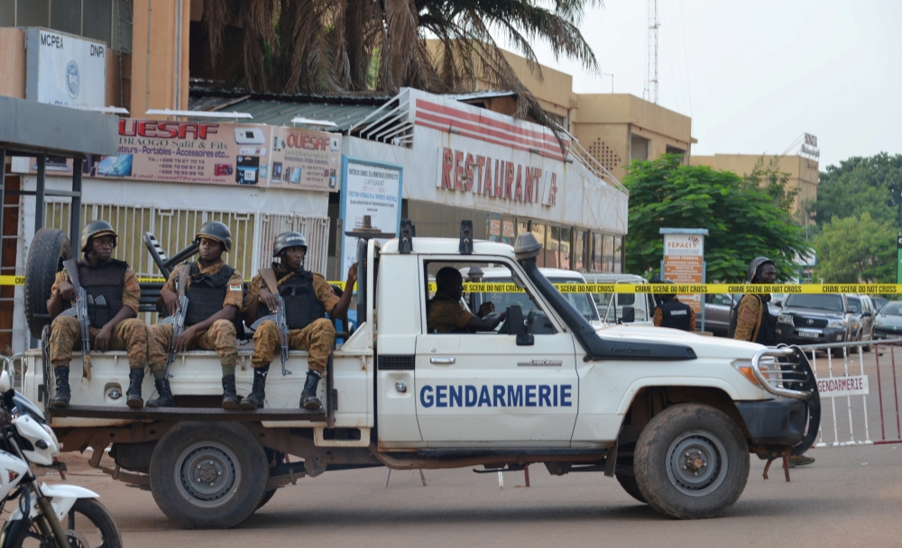 FILE PHOTO: Security forces deploy to secure the area after an overnight attack on a restaurant in the Burkina Faso capital Ouagadougou, August 14, 2017. REUTERS/Hamany Daniex