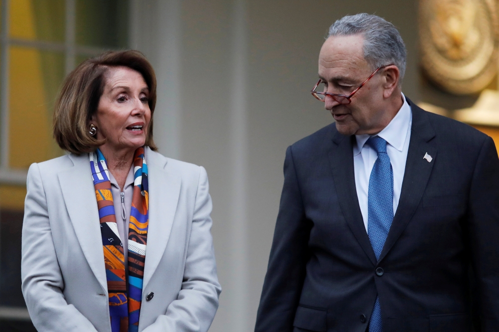 House Democratic leader Nancy Pelosi (D-CA) and Senate Democratic leader Chuck Schumer (D-NY) depart following a border security briefing with U.S. President Donald Trump and congressional leadership at the White House in Washington, U.S., January 2, 2019