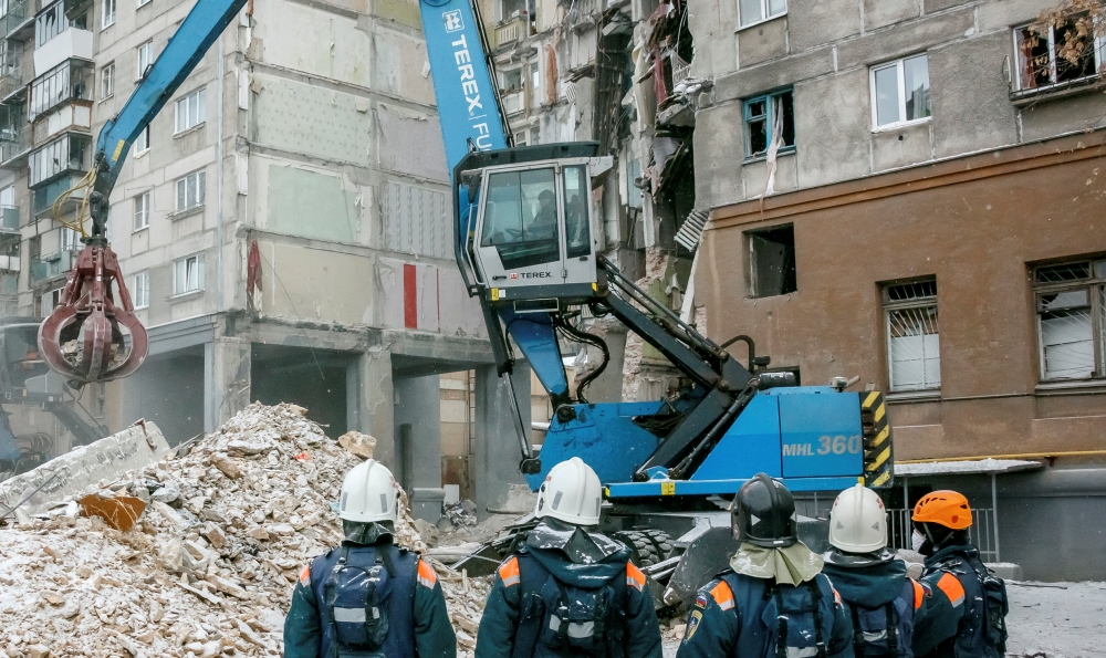Russian Emergencies Ministry members work at the site of a partially collapsed apartment block in Magnitogorsk, Russia January 3, 2019. REUTERS/Andrey Serebryakov