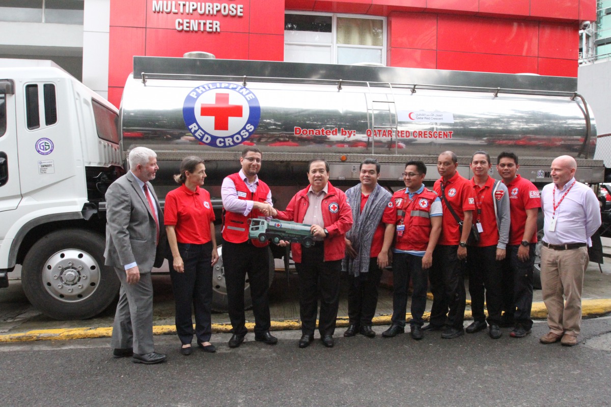 A QRCS representative handing over a water tanker to Philippine Red Cross under the project.