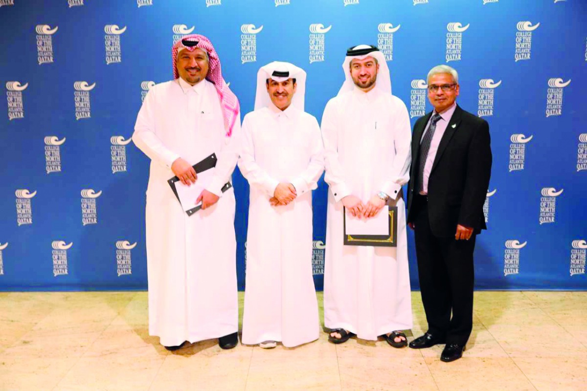 The winners of the CTAB 2018 National Research/Technology Report Contest with Dr Khalifa Khalifa Nasser Al Khalifa, CNA-Q President  (second left) and Errol Persaud, P.Eng, Education Consultant with CTAB at a ceremony.