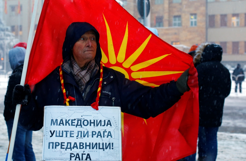 Supporters of the movement boycotting the deal with neighbouring Greece to change the country's name to the Republic of North Macedonia protest in front of the parliament building during parliamentary debates on constitutional amendments related to the na