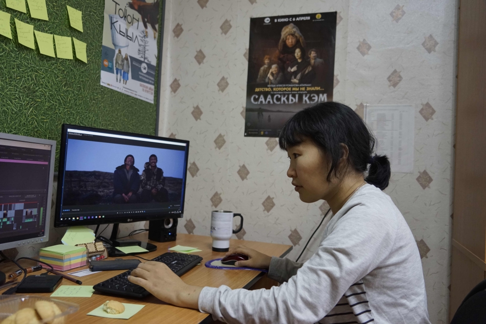 Yakutian filmmaker Lyubov Borisova works on her film in Sakhafilm production studio office in Yakutsk on November 29, 2018.  AFP / Maria Antonova