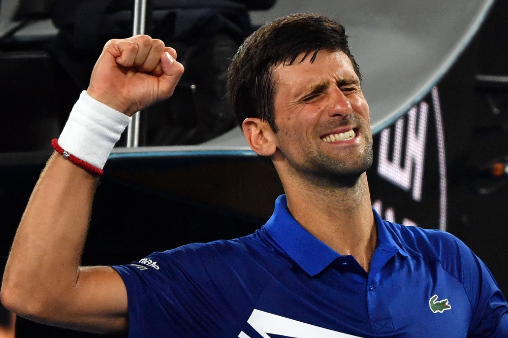 Serbia's Novak Djokovic celebrates his victory against Mitchell Krueger of the US during their men's singles match on day two of the Australian Open tennis tournament in Melbourne on January 15, 2019. AFP / Paul Crock 