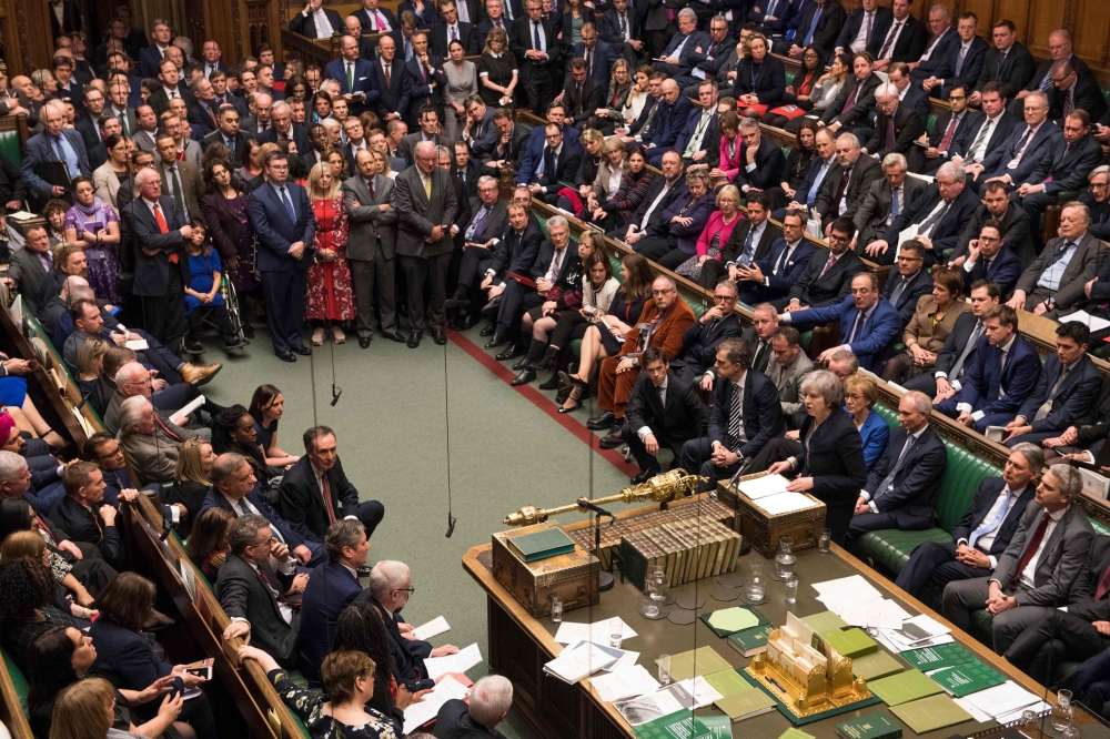 A handout photograph released by the UK Parliament shows Britain's Prime Minister Theresa May making a statement in the House of Commons in London on January 15, 2019 directly after MPs rejected the government's Brexit deal. AFP PHOTO /MARK DUFFY / UK Par