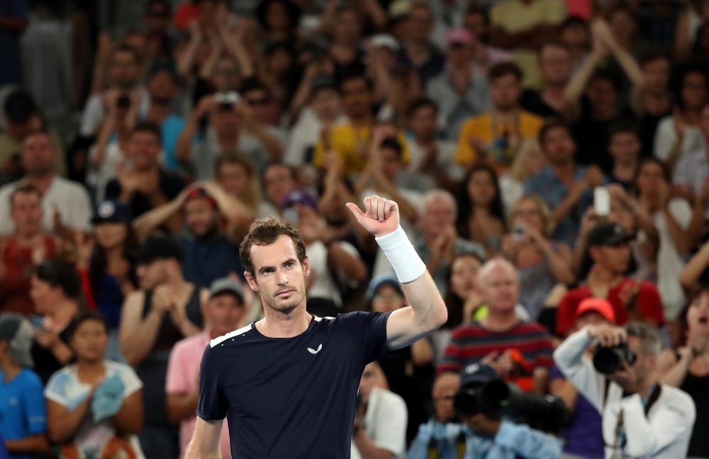 Britain's Andy Murray looks dejected after losing the match against Spain's Roberto Bautista Agut. REUTERS/Lucy Nicholson