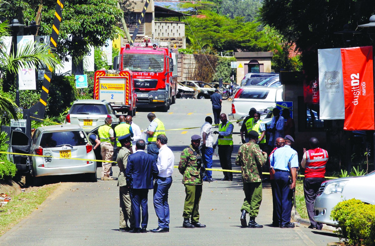 Kenyan policemen and explosives experts gather evidence from the car suspected to have been used by the attackers outside the scene where explosions and gunshots were heard at The DusitD2 complex, in Nairobi, Kenya January 17, 2019. Reuters/Njeri Mwangi