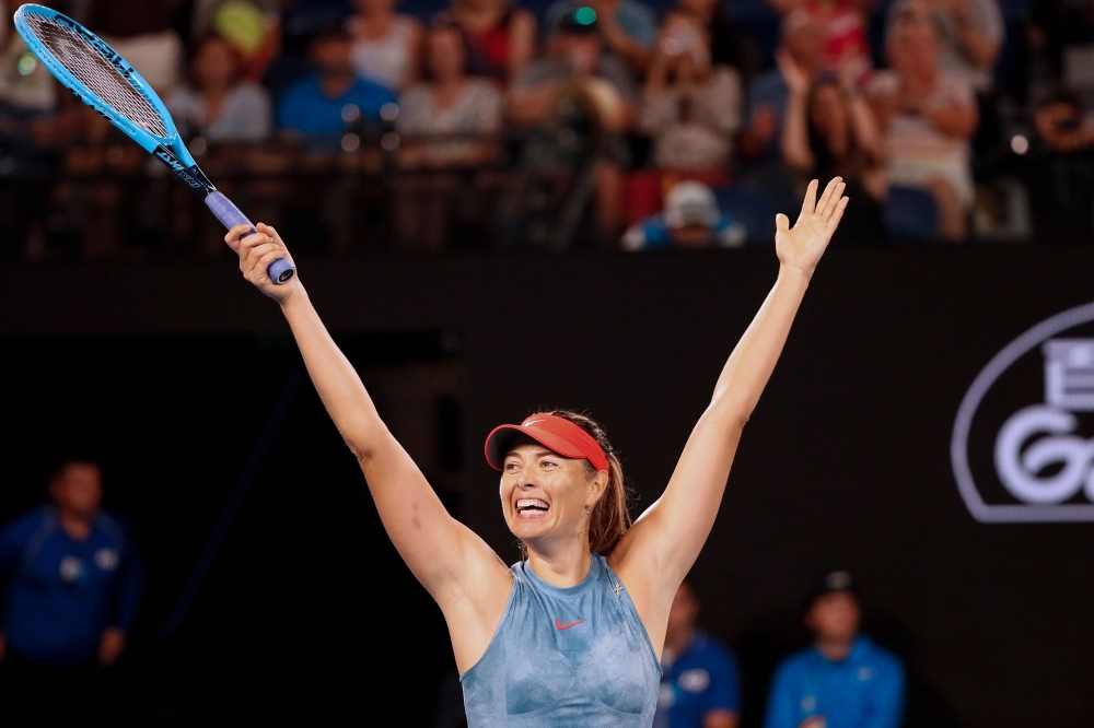 Russia's Maria Sharapova celebrates her victory against Denmark's Caroline Wozniacki during their women's singles match on day five of the Australian Open tennis tournament in Melbourne on January 18, 2019. AFP / DAVID GRAY 