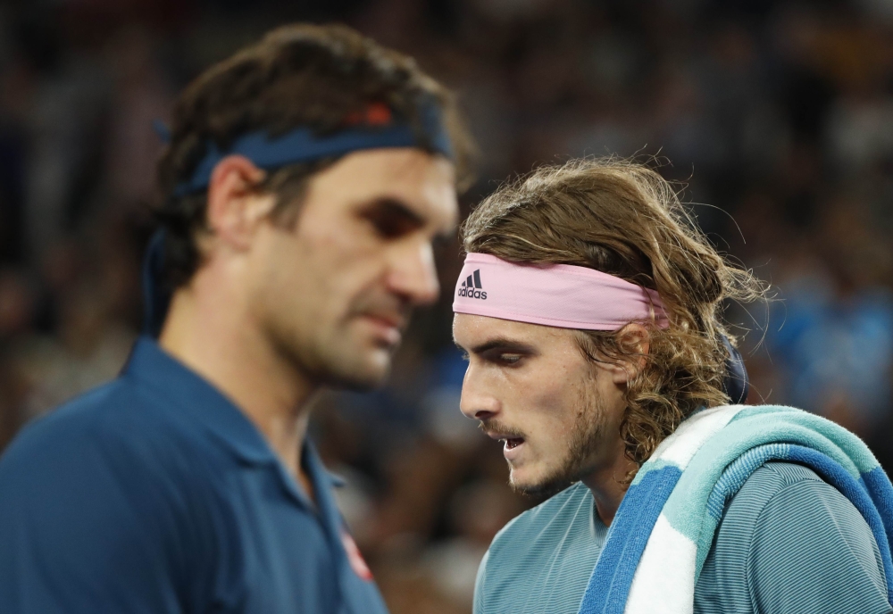 Switzerland’s Roger Federer and Greece’s Stefanos Tsitsipas during the match. REUTERS/Aly Song