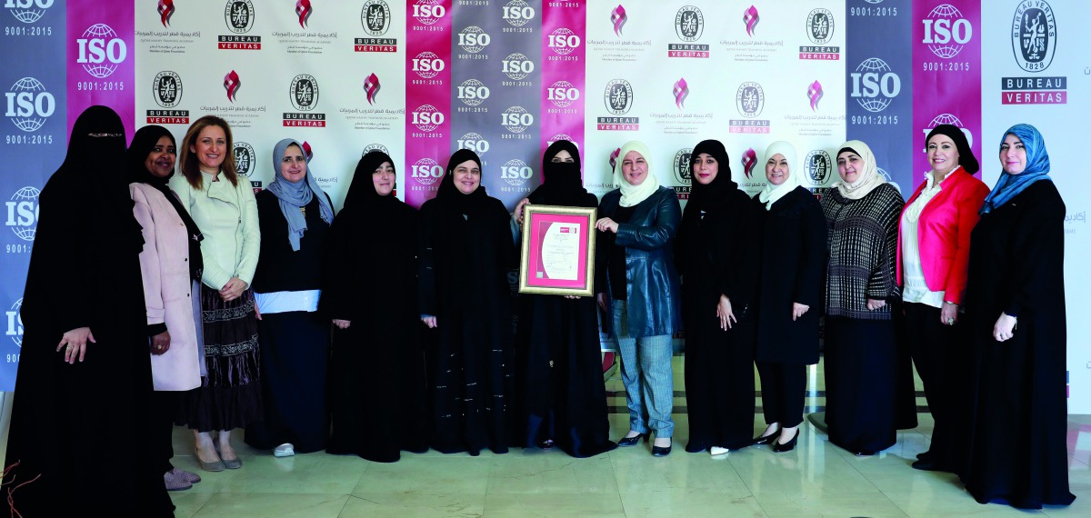 QNTA officials with the certification for excellence.